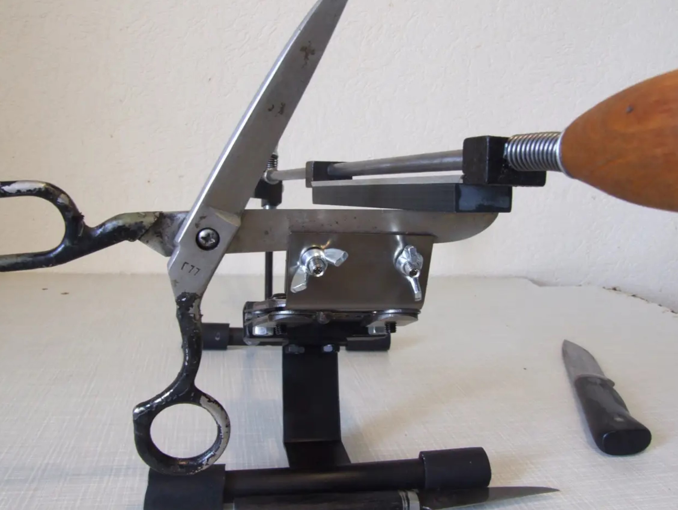 Expert craftsman sharpening scissors